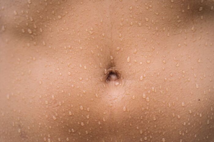 Close-up of a person's sweaty skin, illustrating the importance of good hygiene habits.