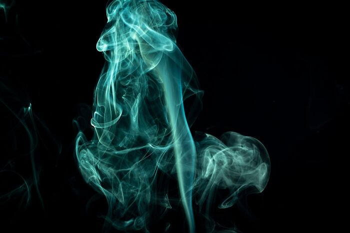 Abstract blue smoke pattern illustrating the concept of transformation through exercise.