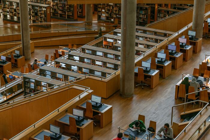 Library interior with computers and desks, showcasing moments of historical influence.