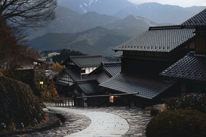 Traditional Japanese houses in a mountain village, illustrating a historical influence.