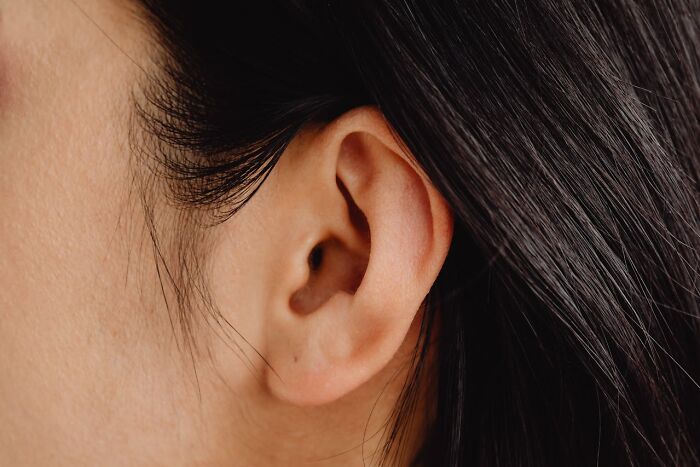 Close-up of a person's ear highlighting hygiene habits.