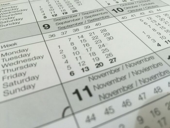 Close-up of a calendar page showing September to November dates, highlighting everyday facts.