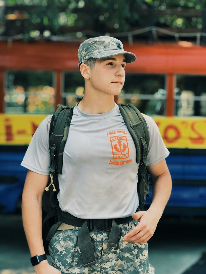 Person in military uniform, standing outdoors, wearing a cap, related to professions and dealbreakers in relationships.