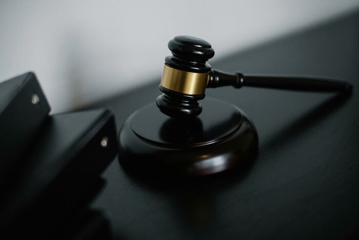 A judge's gavel on a desk symbolizing professions as potential partner dealbreakers.