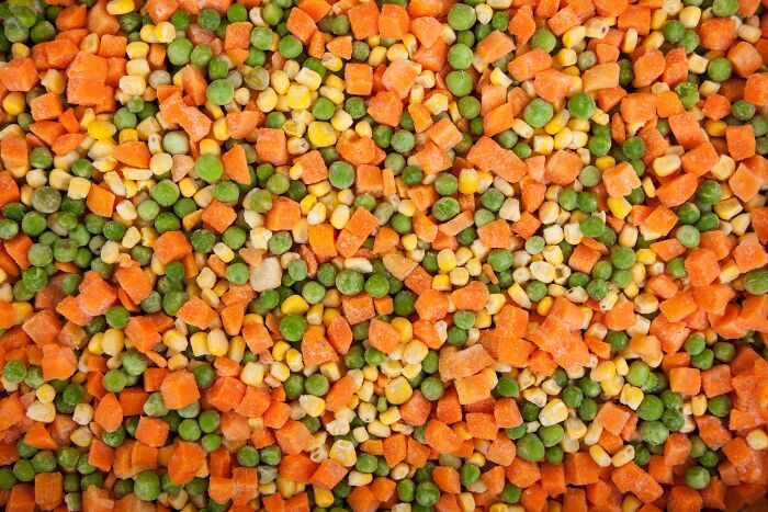 Frozen mixed vegetables including peas, corn, and carrots, showcasing a frugal home hack for easy and affordable meals.