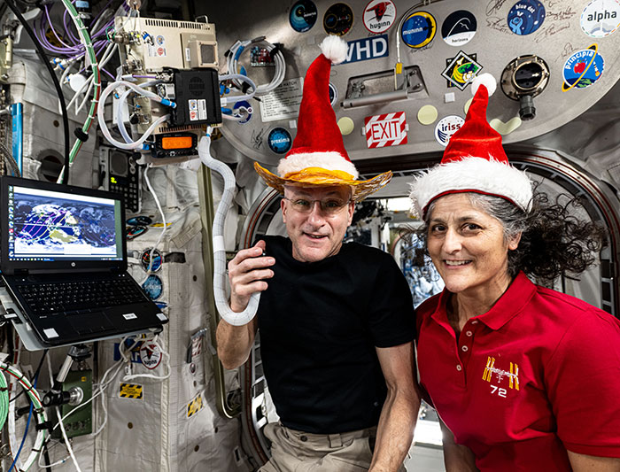 Festive Photo Of Stranded Astronauts Sparks Conspiracy Theories: “Something Fishy Is Going On”