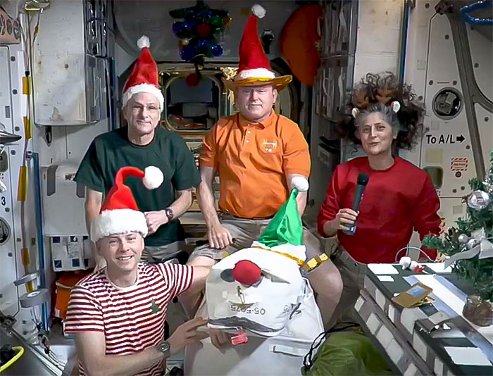 Festive Photo Of Stranded Astronauts Sparks Conspiracy Theories: “Something Fishy Is Going On”