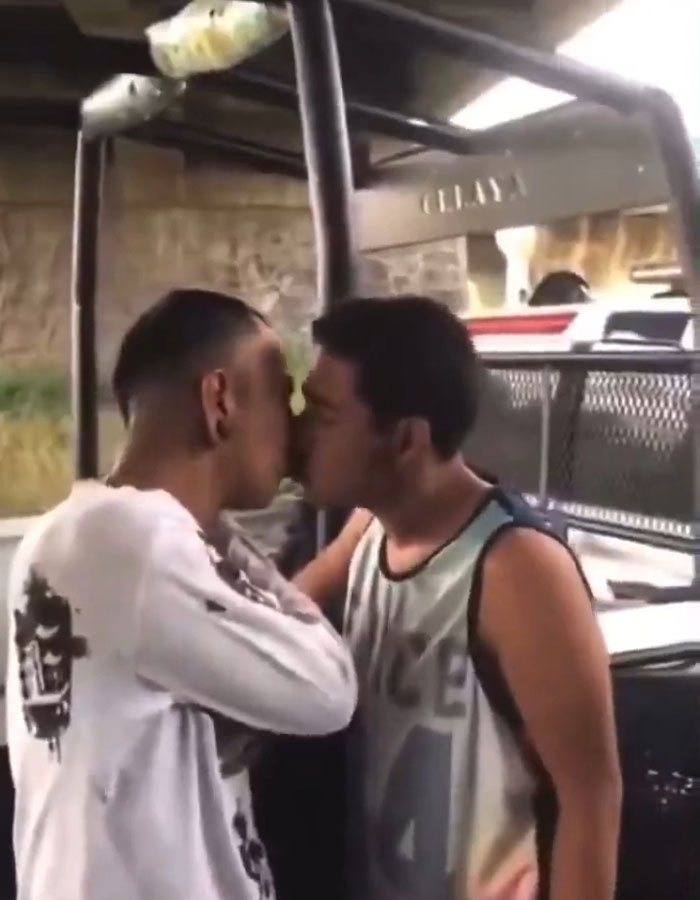 Police Officers Humiliate, Beat, And Force Two Men To Kiss Each Other: "Stick Your Tongue In"