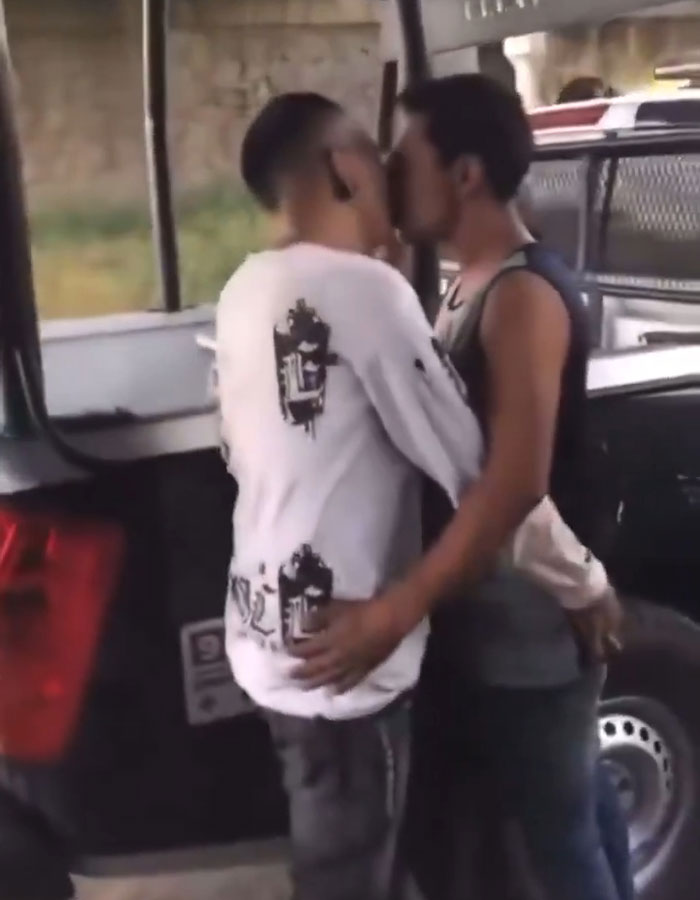 Police Officers Humiliate, Beat, And Force Two Men To Kiss Each Other: "Stick Your Tongue In"