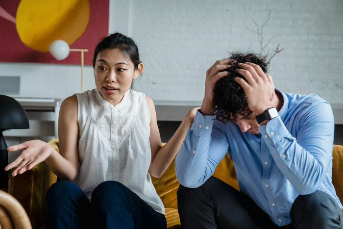 A woman discussing with a boyfriend who looks stressed, refusing dating conversation.