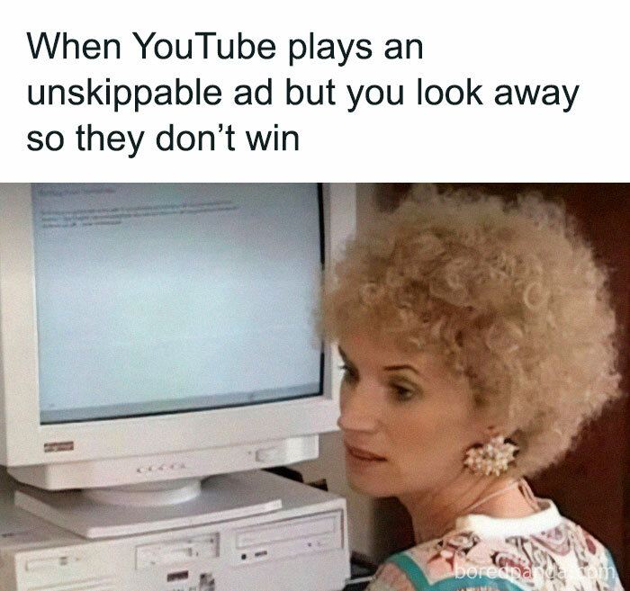 Humorous meme of a woman looking away from a computer screen, referencing unskippable YouTube ads.