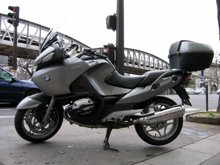 Motorcycle parked on city street, a great gift idea for retirees seeking adventure and freedom.