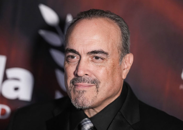 David Zayas in a black suit at a red carpet event, related to The Bear cast and guest appearances in Season 3.