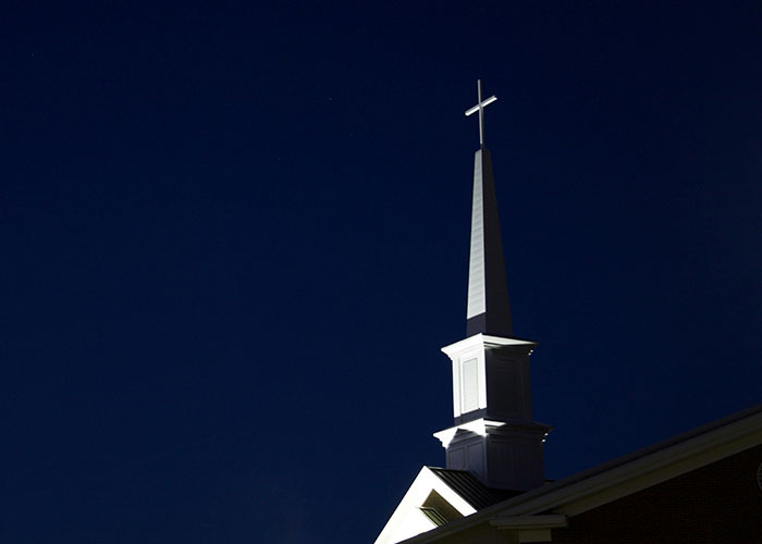 Church steeple against a dark night sky, symbolizing the contrast between desired things and their actual unpleasantness.