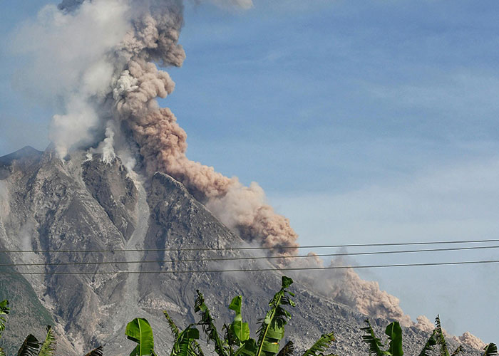 Volcano erupting with smoke and ash, illustrating how things people want can be actually terrible.