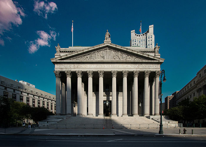 Historic courthouse with grand columns under a clear blue sky, symbolizing things people want that may be actually terrible.