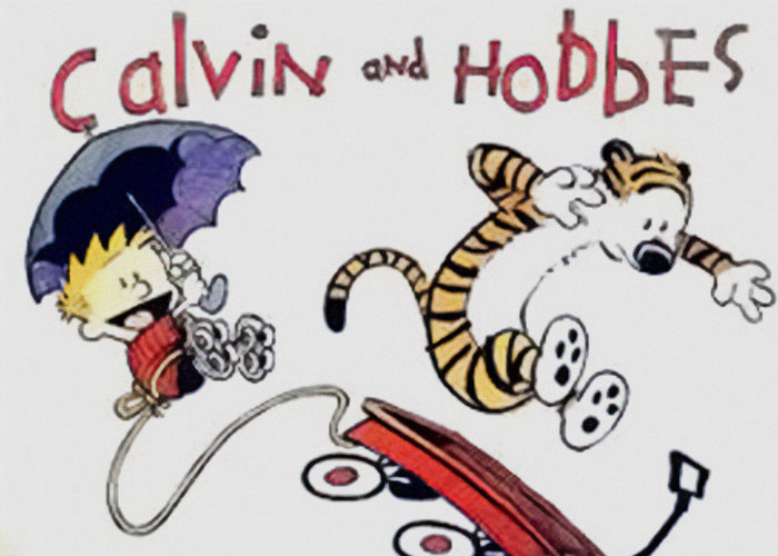 Cartoon characters Calvin and Hobbes jumping with excitement from a red sled.