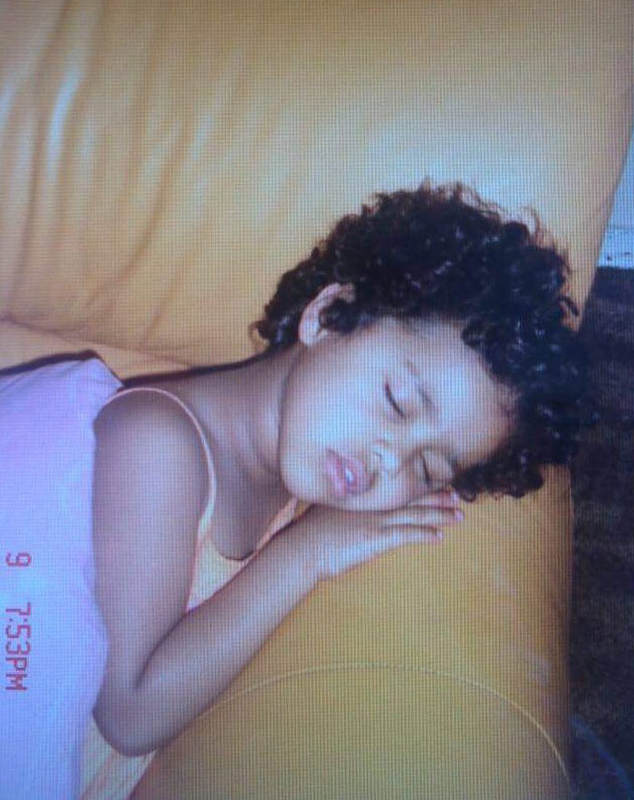 A young girl, identified as Tyla, around age 3-5, peacefully sleeping on a yellow couch, wearing a pink dress. Timestamp shows 7:53 PM.