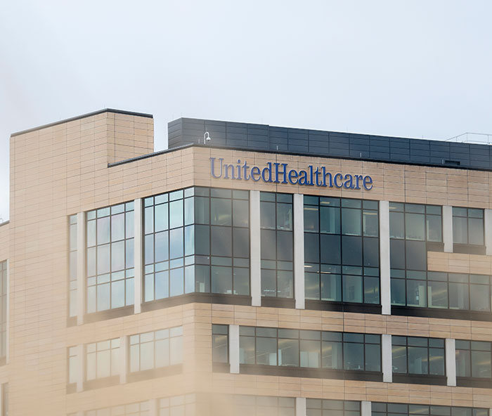 Exterior view of UnitedHealthcare building with large windows and logo.