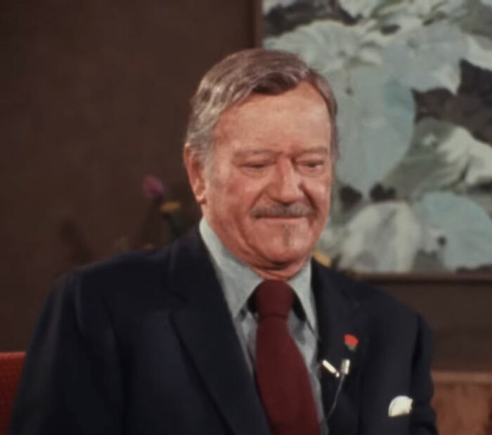 John Wayne smiling