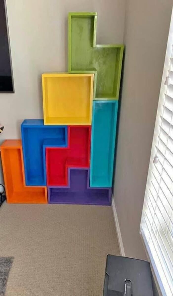 Colorful, Tetris-shaped shelving unit showcasing a spectacular second-hand discovery in a room corner.