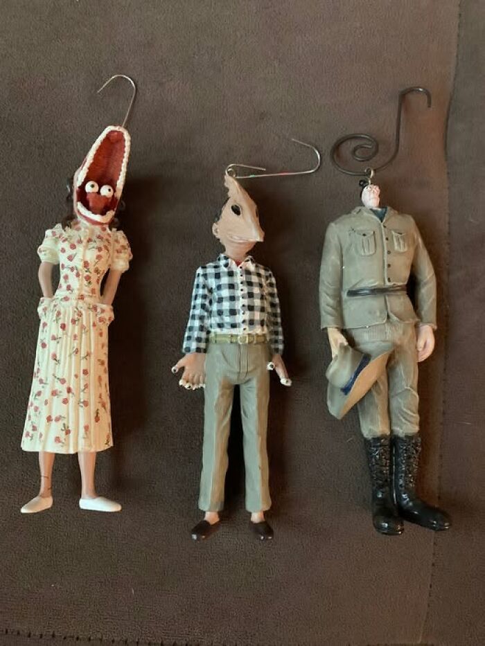 Strange second-hand figurines with unique and bizarre designs in various outfits, showcasing eclectic oddities.