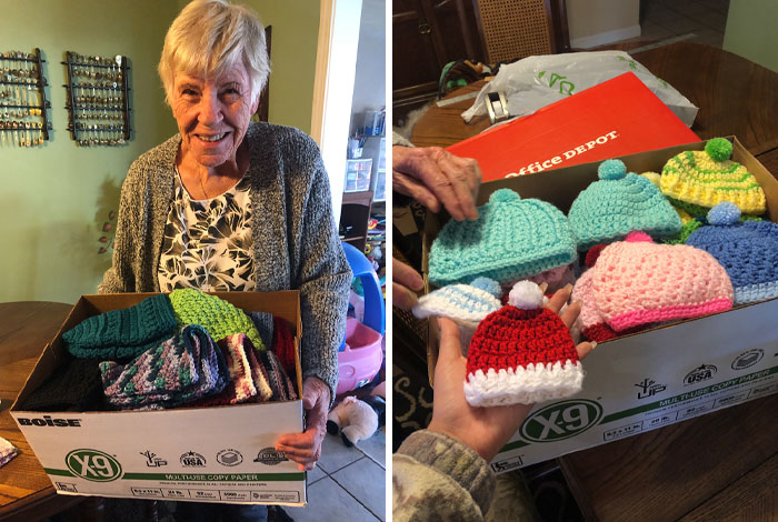 Elderly woman smiling, holding a box of colorful, knitted hats, showcasing wholesome Christmas posts.