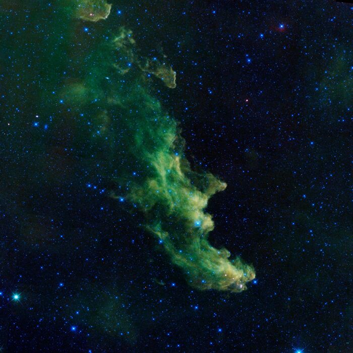 Green nebula with stars, showcasing amazing cosmic clouds in deep space.