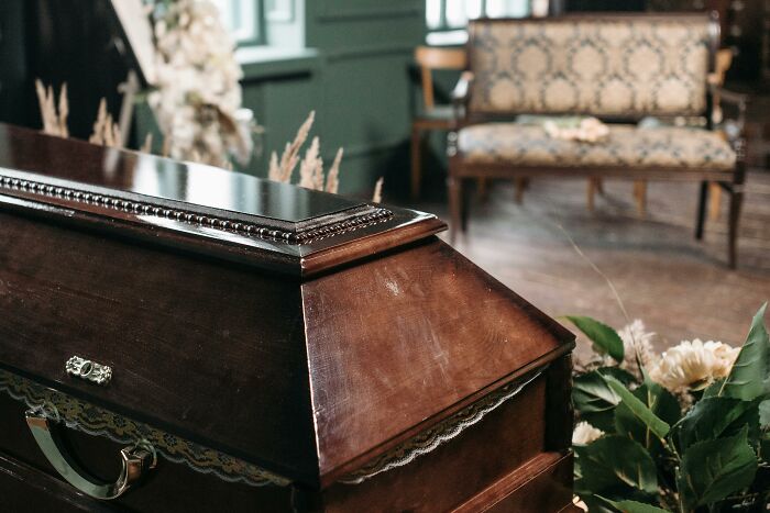 Coffin in a dimly lit room.