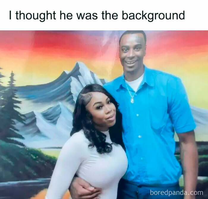 Couple posing in front of a painted landscape backdrop; a humorous result typical of worst funny fails.