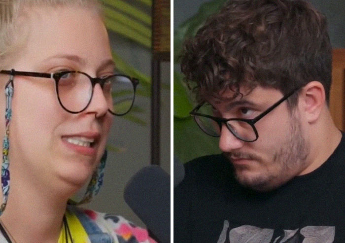 A woman discusses her mental health while a man listens, both wearing glasses, in a casual conversation setting.