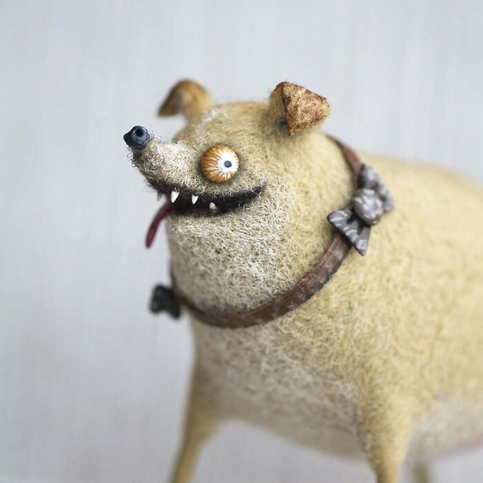 Strange art doll resembling a quirky animal with oversized eyes and a humorous expression.