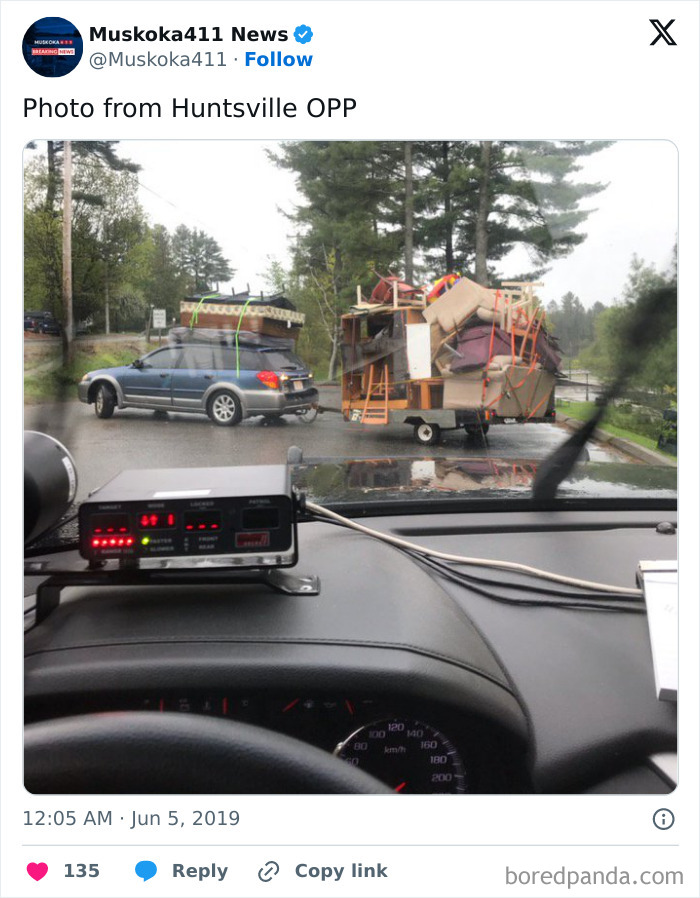 Car towing an overloaded trailer, spotted by police, illustrating risky driving behavior for "Idiots In Cars" theme.