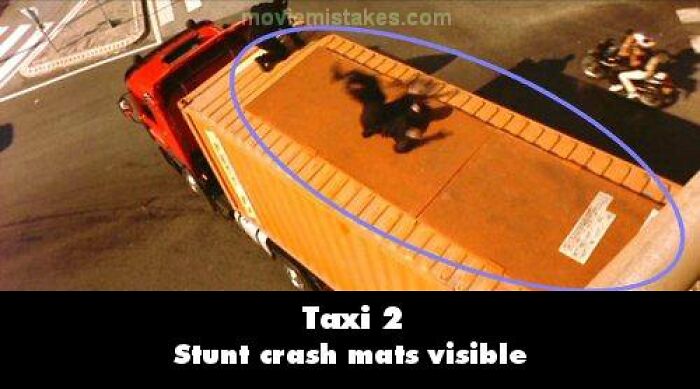 Stunt crash mats visible on a truck in Taxi 2 scene, highlighting funny movie mistakes.