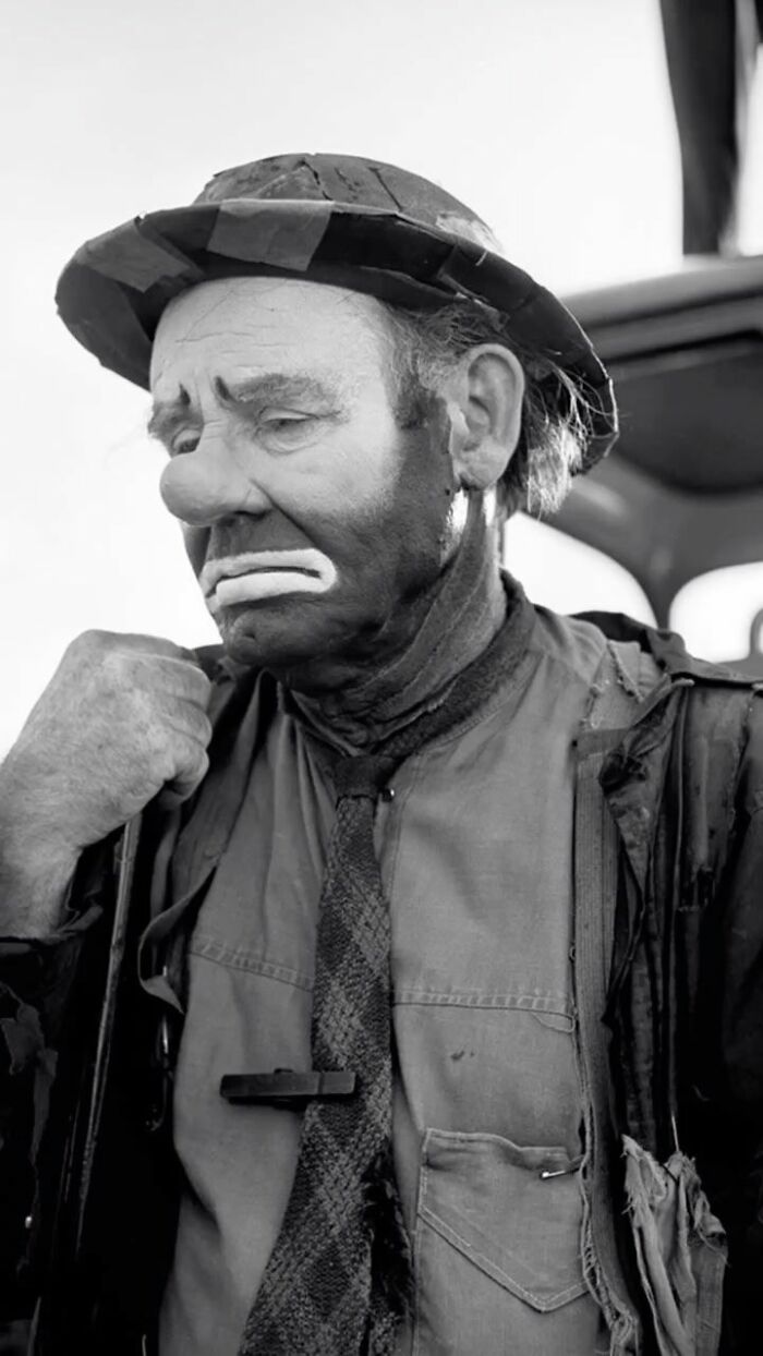 Black and white photo of a sad-looking clown in costume, captured as one of the most interesting images by an Instagram page.