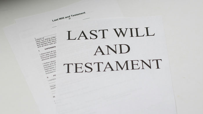 Image of a "Last Will and Testament" document, symbolizing potential corruption involving official procedures and officers.