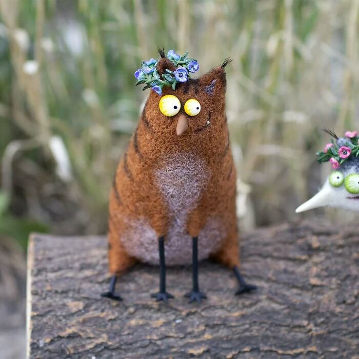 Funny-looking animal dolls by Georgian artist, featuring a whimsical felt owl with a floral crown.