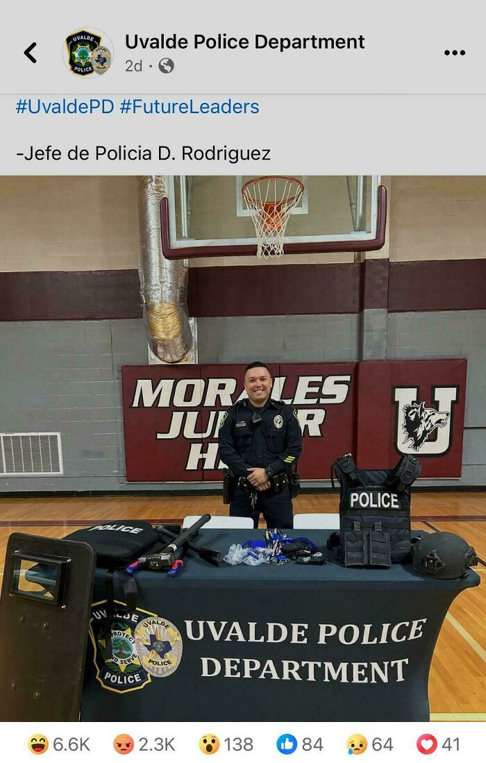 Police officer in gym with Uvalde Police Department gear displayed, suggesting a boring dystopia.