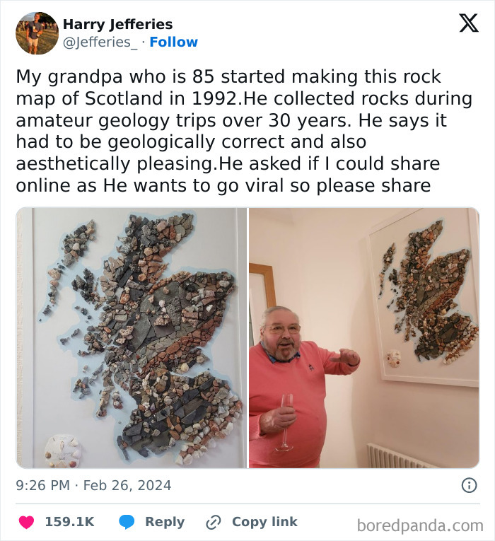 Elderly man proudly showing a rock map of Scotland, crafted with collected stones.