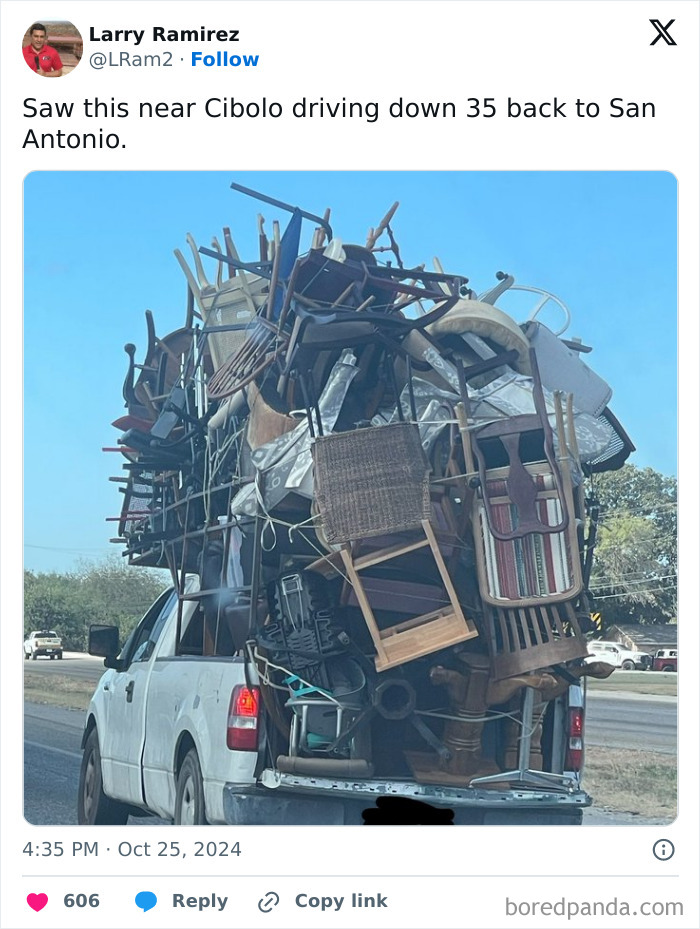 Overloaded pickup truck with a precarious stack of furniture, illustrating the chaos of idiots in cars.