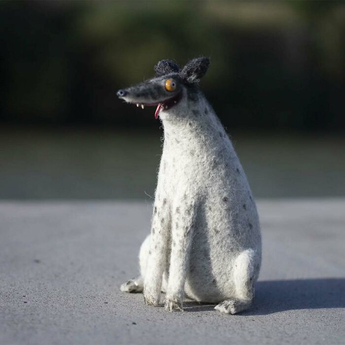 Strange art doll of a funny-looking animal with a long nose and spotted fur, created by a Georgian artist.