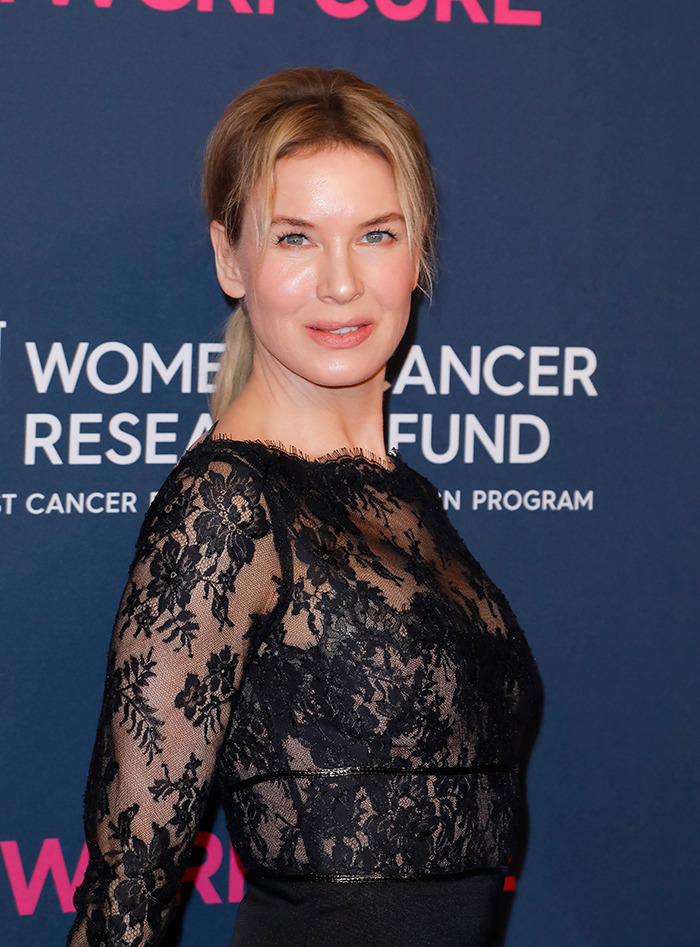 Renée Zellweger at an event, wearing a black lace dress, showcasing her style changes over the years.