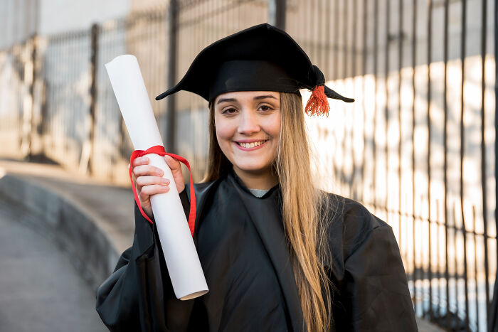 Graduate holding diploma, highlighting realization of overlooked issues during adulthood.