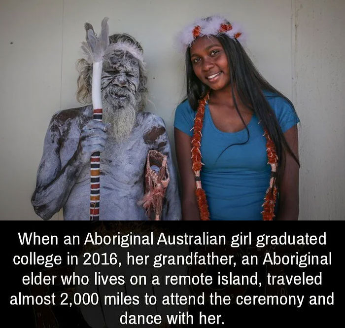 Aboriginal elder and granddaughter celebrating her college graduation with traditional attire and painted designs.