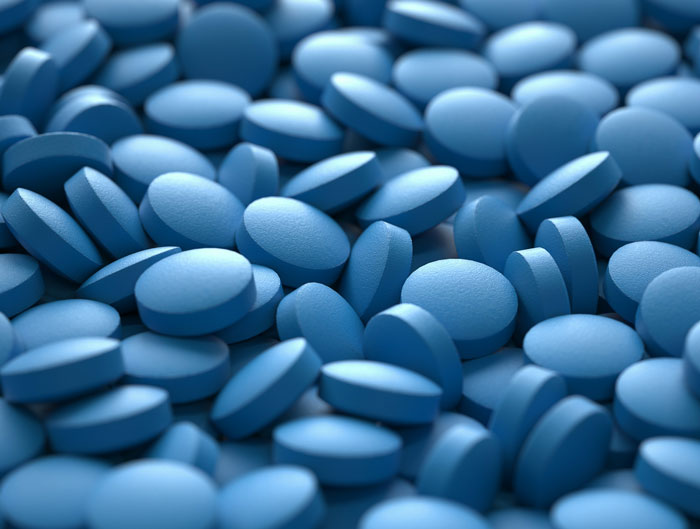 Blue pills scattered, representing family secrets discussed in private stories.