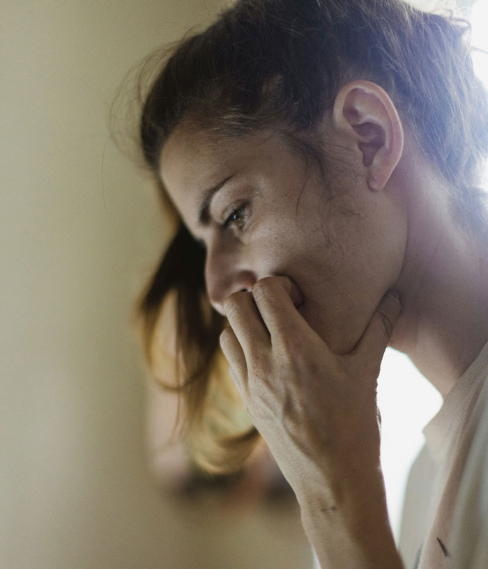 Person looking concerned after reading note from Amazon driver.