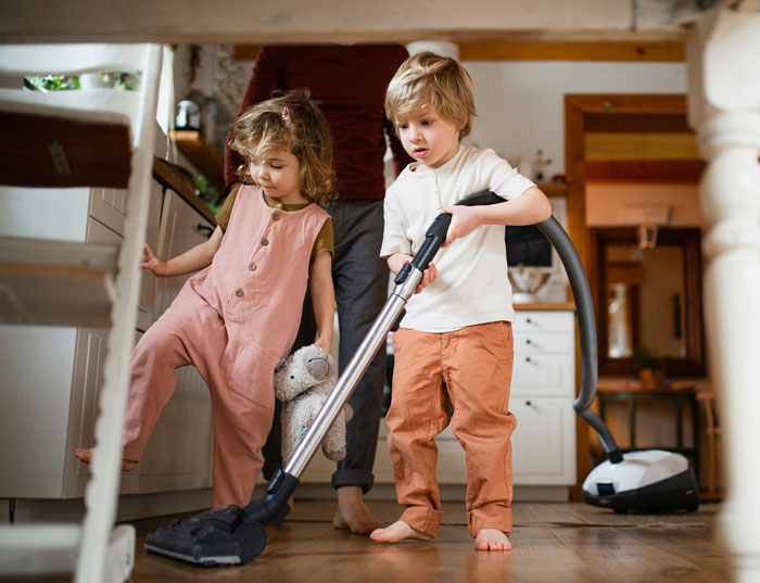 Children doing chores at home, a scene reflecting parenting insights on chores without pay.