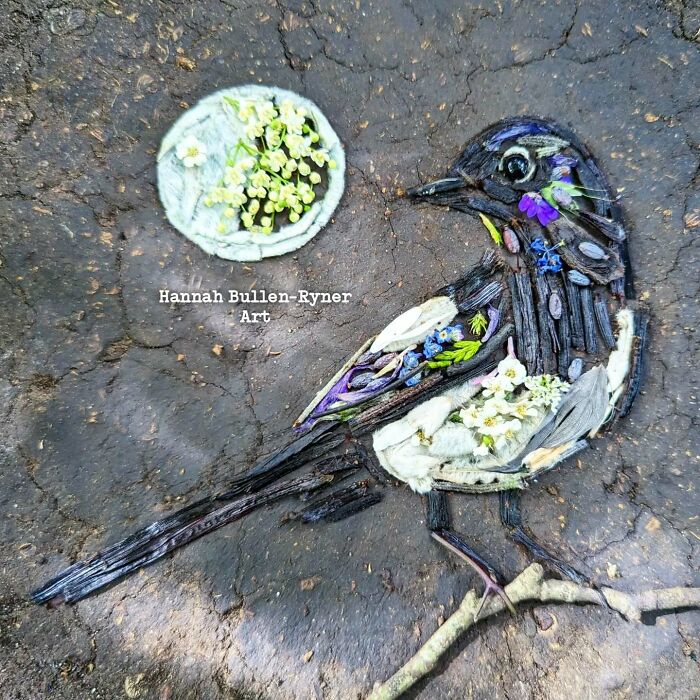 Nature-made bird portrait featuring detailed earth art using flowers and twigs.