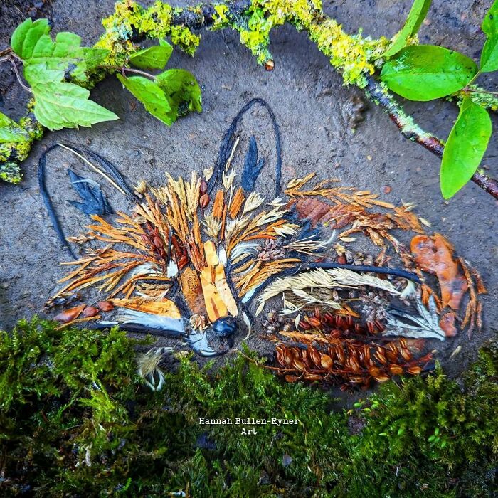 Nature materials form a detailed animal portrait with leaves and twigs in earth art.