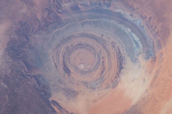 Aerial view of the Richat Structure, a stunning natural phenomenon resembling a bull's eye in the Sahara Desert.